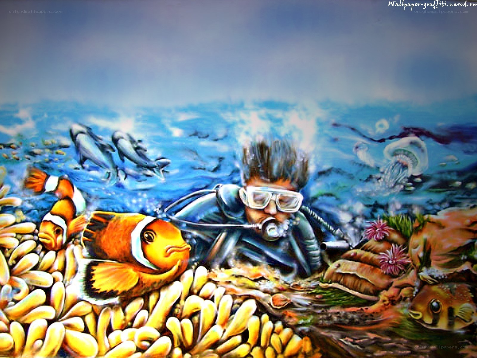 diver with clownfish underwater