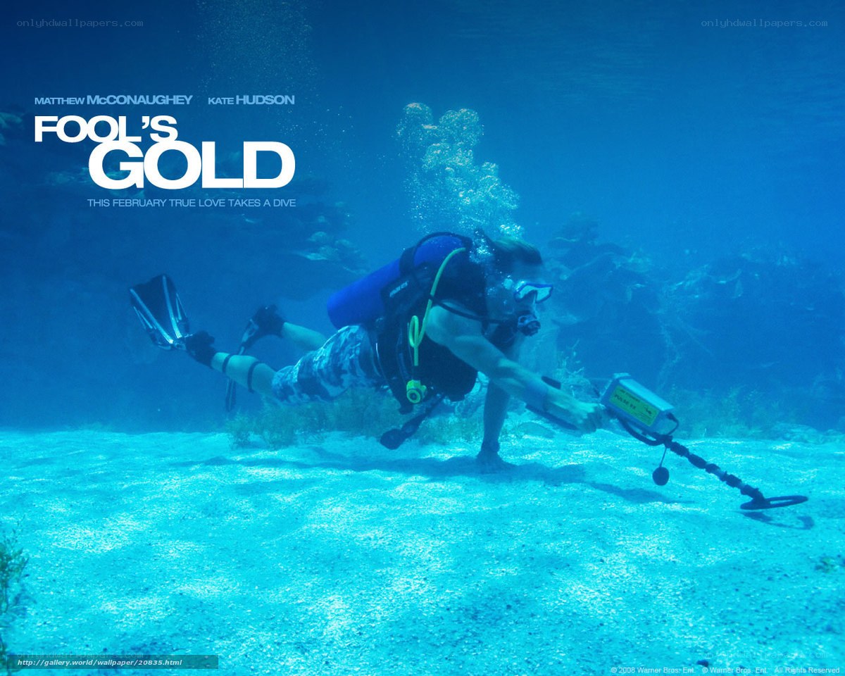 Diver with metal detector underwater