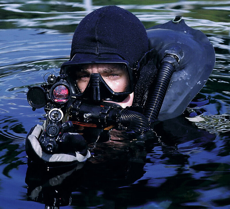 diver with underwater firearm