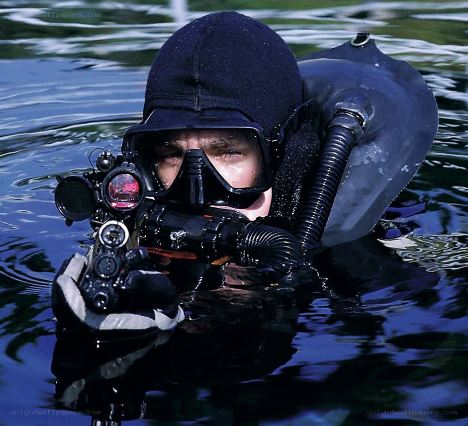 diver with underwater firearm