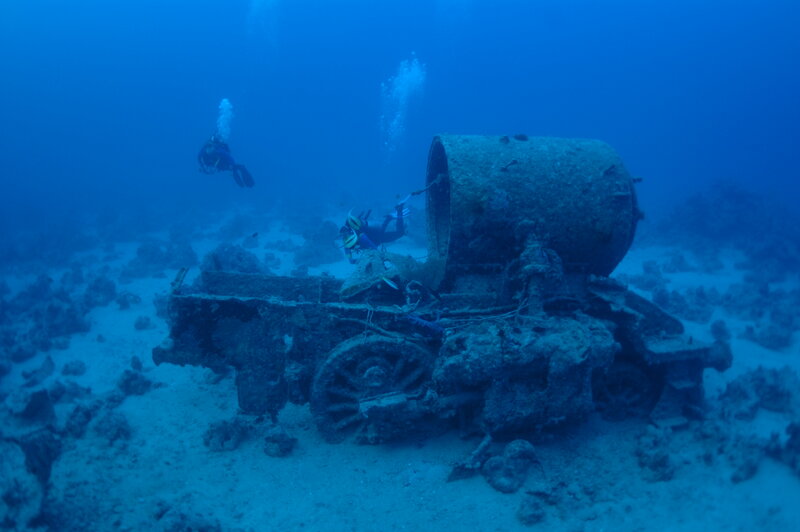 Divers Exploring Shipwreck — Blue, Serene
