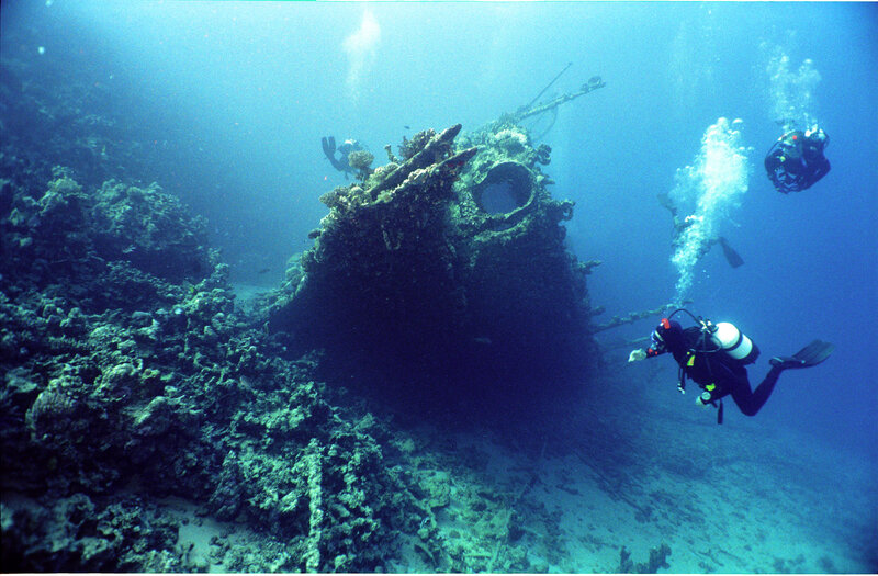 Divers exploring shipwreck