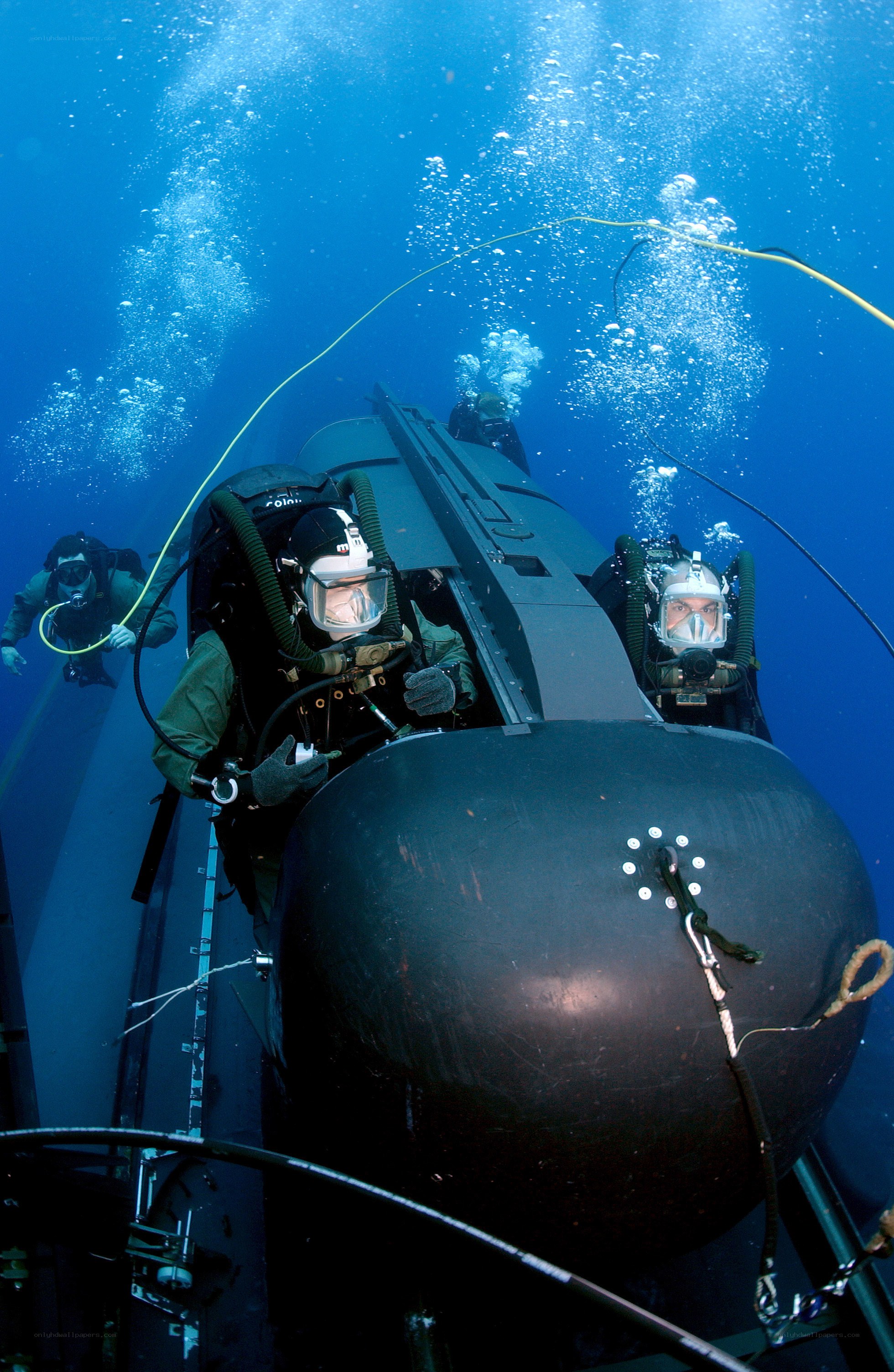 divers with submersible underwater
