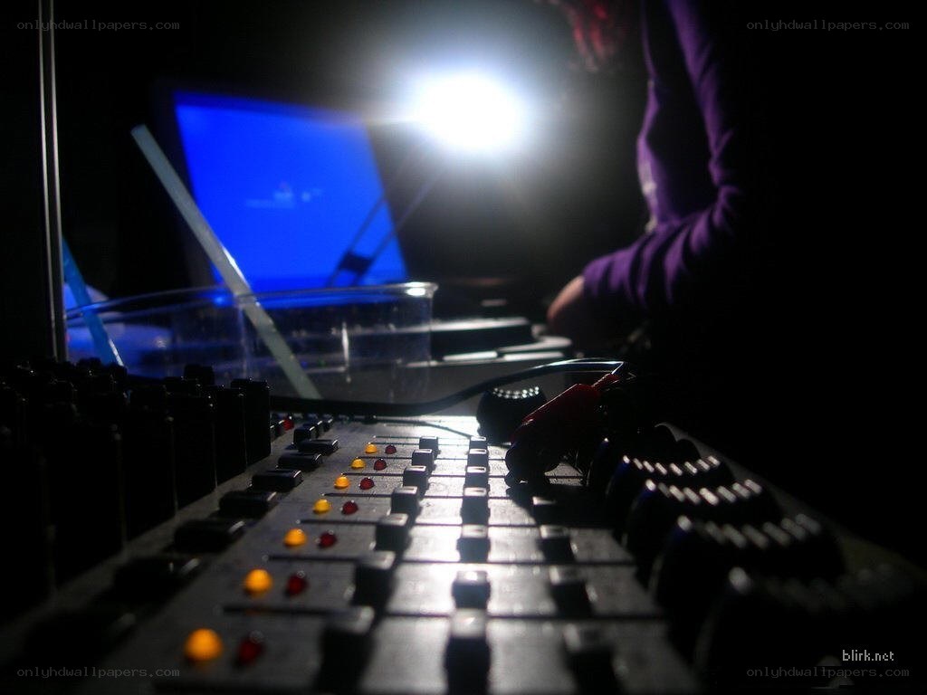 DJ at a soundboard