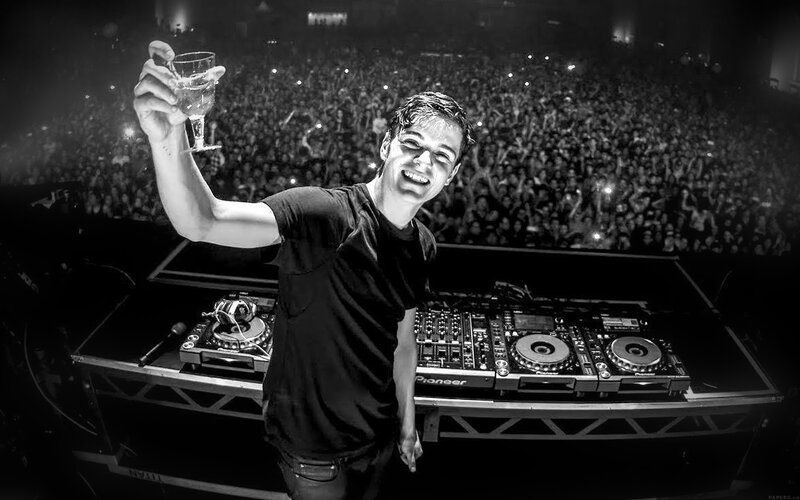 DJ at Concert with Crowd