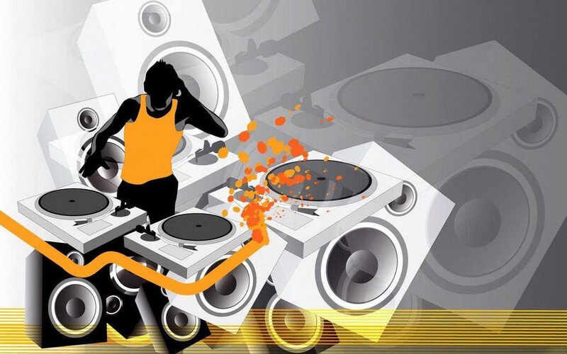 DJ at turntables with speakers