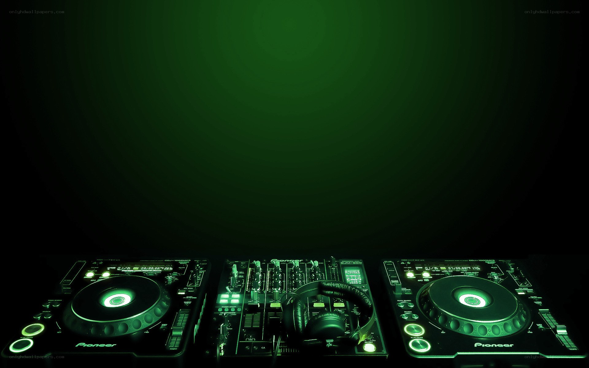 DJ equipment in green light