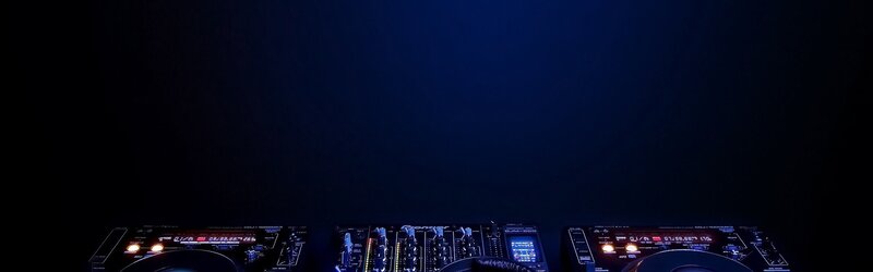 DJ Equipment on Dark Surface — Black