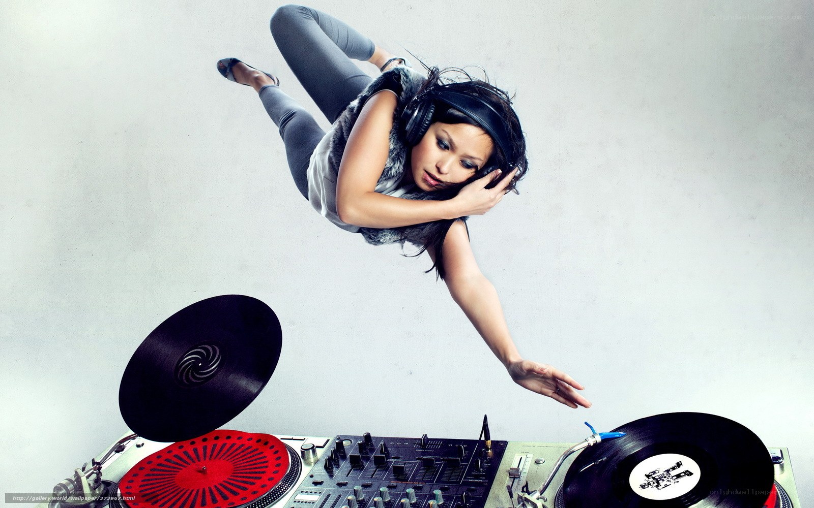 DJ in mid-air with turntables