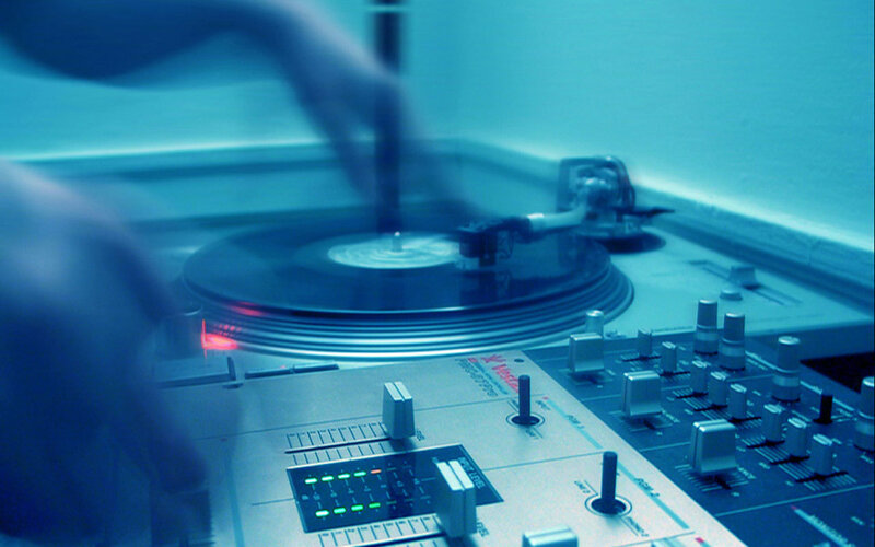 DJ mixing music on turntables