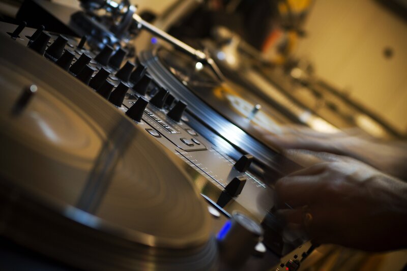 DJ mixing music on turntables
