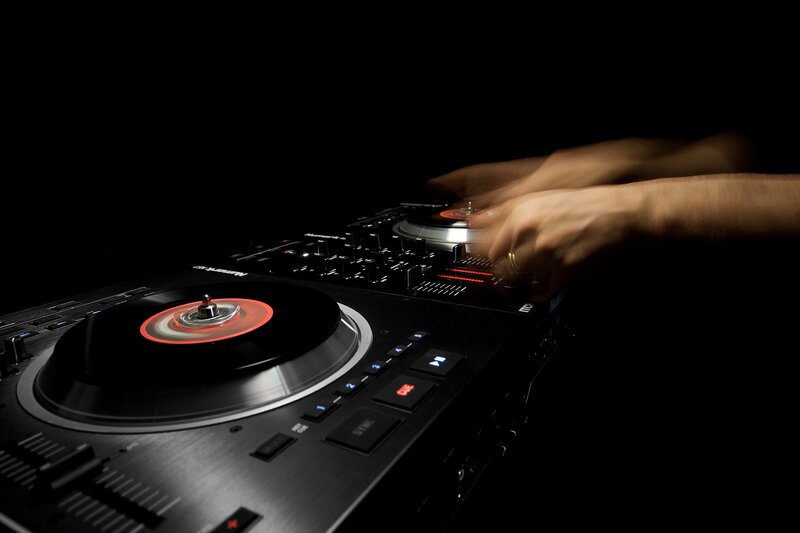 DJ mixing music on turntables