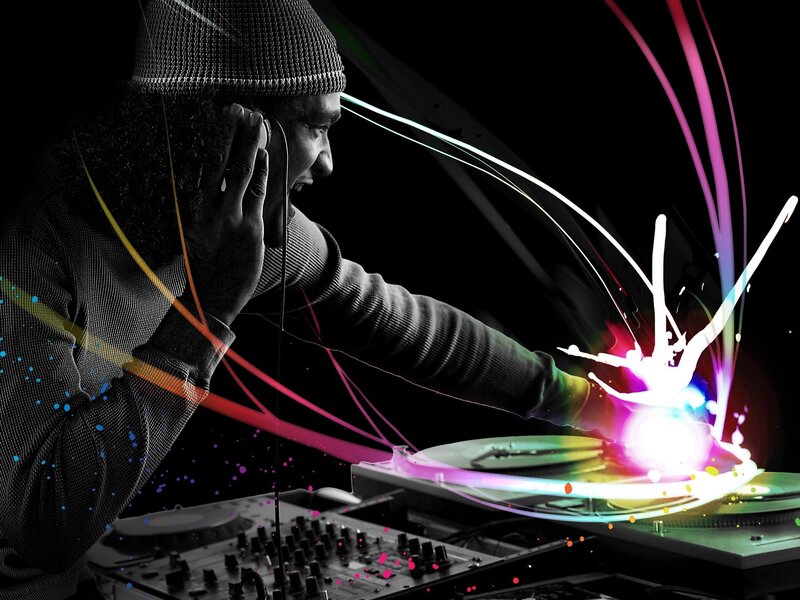 DJ mixing music with colorful lights
