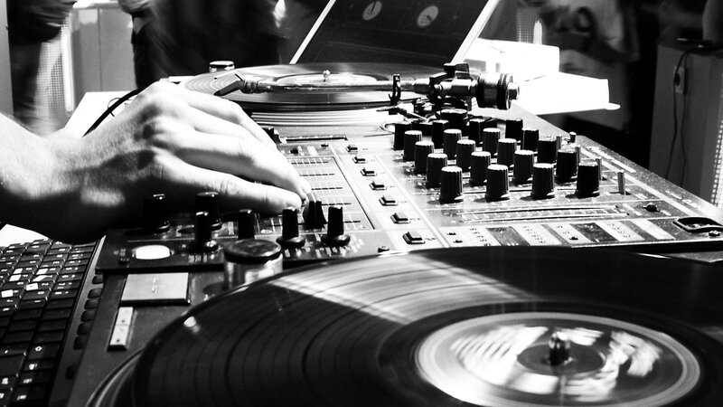 DJ mixing records at a club