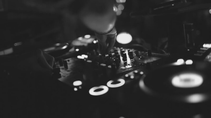 DJ Operating Turntables — Black, Dark