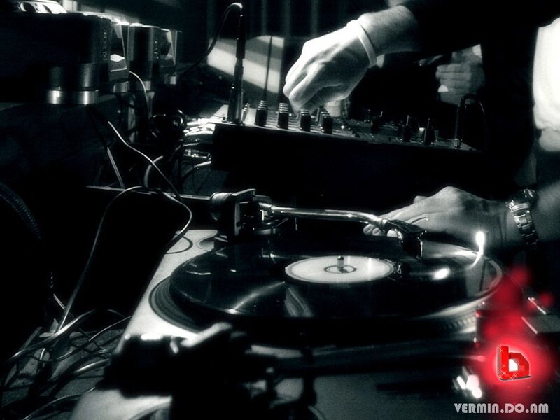DJ Operating Turntables — Black, Dramatic