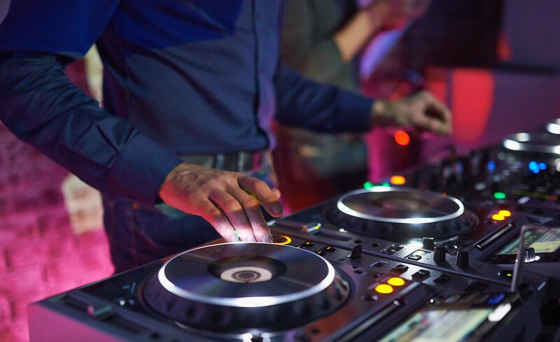 Dj Operating Turntables — Black, Energetic