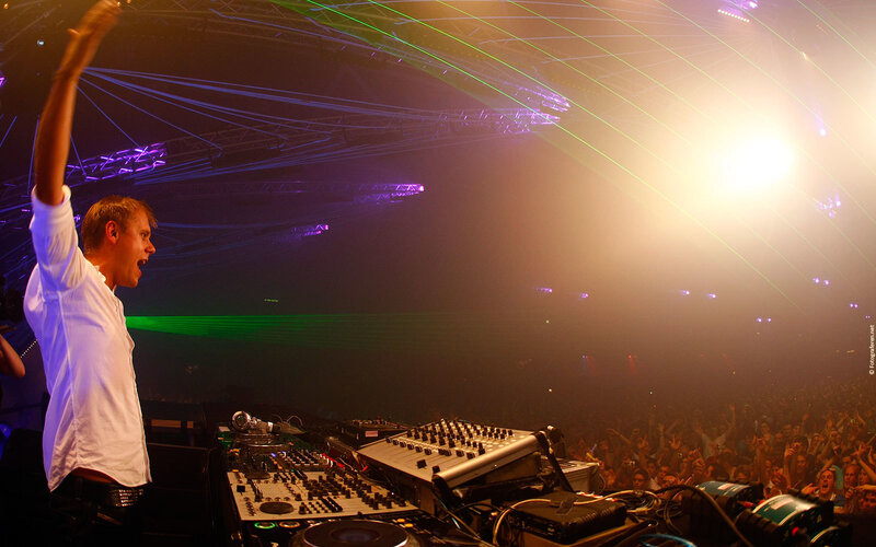 DJ Performing at Concert — Black, Energetic, Night, Photograph, Crowd, Laser Lights