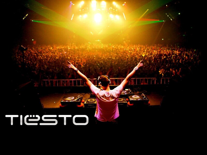 DJ Performing at Concert — Black, Energetic, Night, Photograph, Crowd, Lights