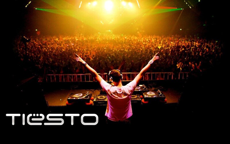 DJ Performing at Concert — Black, Energetic, Night, Photograph, Crowd, Turntables, Stage Lights