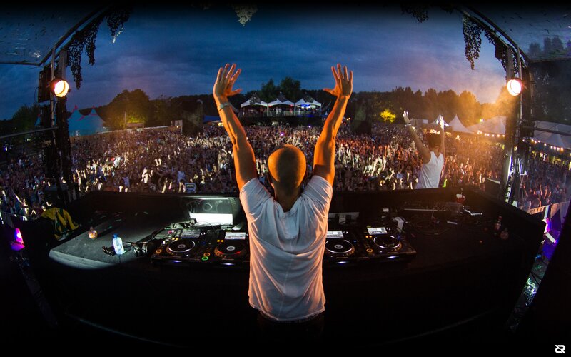 DJ Performing at Festival — Black, Energetic, Night