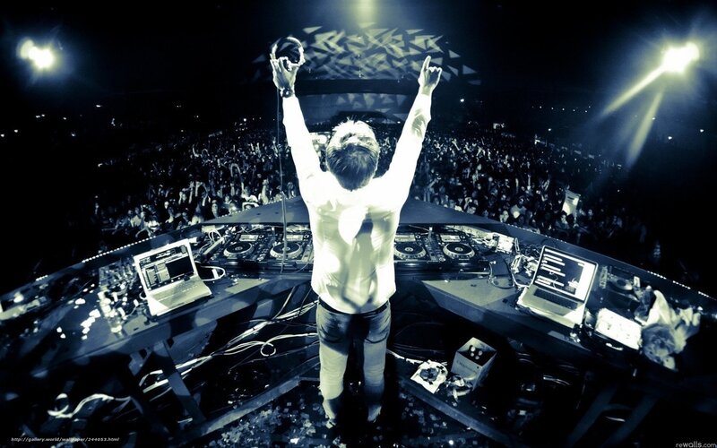 DJ Performing on Stage — Black, Energetic, Night, Photograph