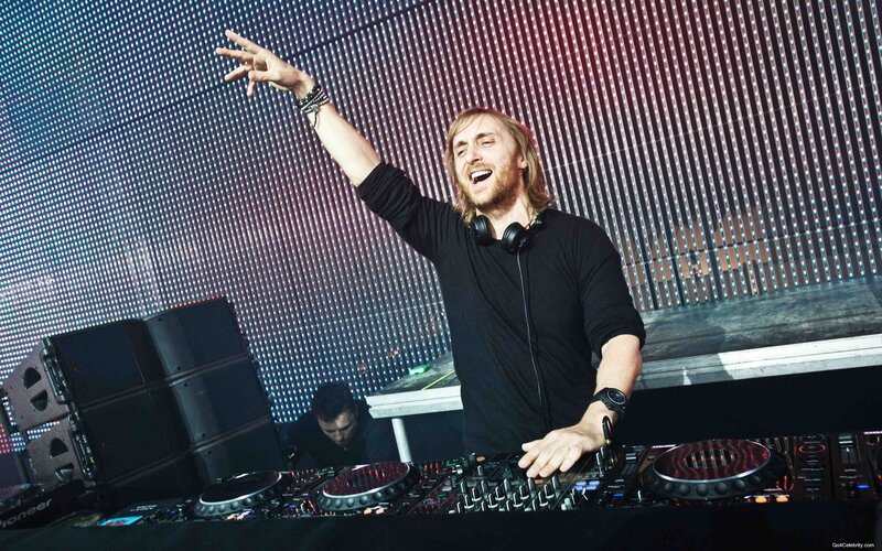 DJ Performing on Stage — Black, Energetic