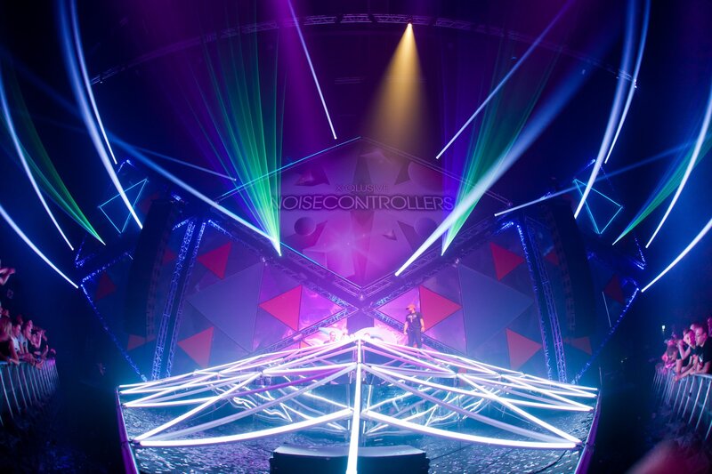 DJ Performing on Stage — Purple, Energetic, Night, Photograph