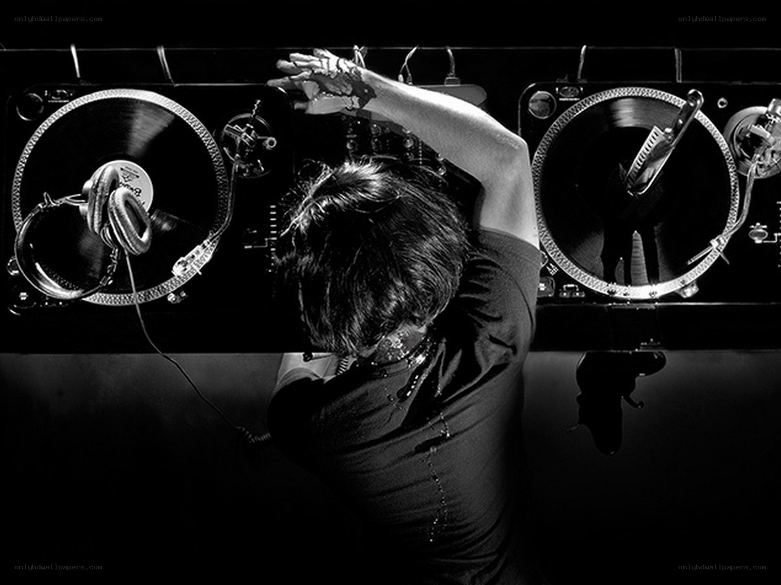 DJ performing on turntables