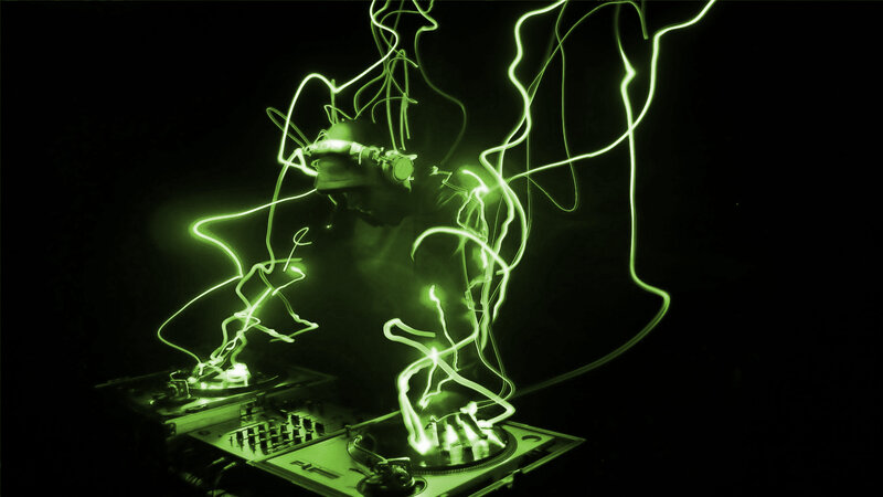 DJ performing with light trails