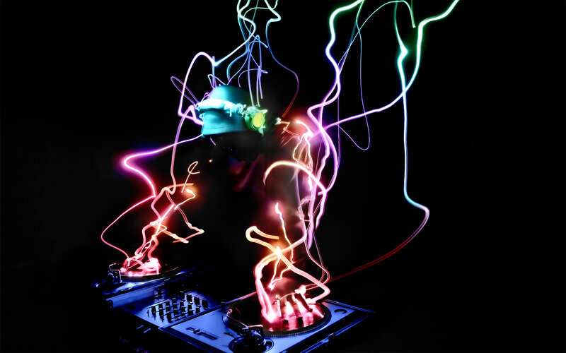 DJ performing with light trails
