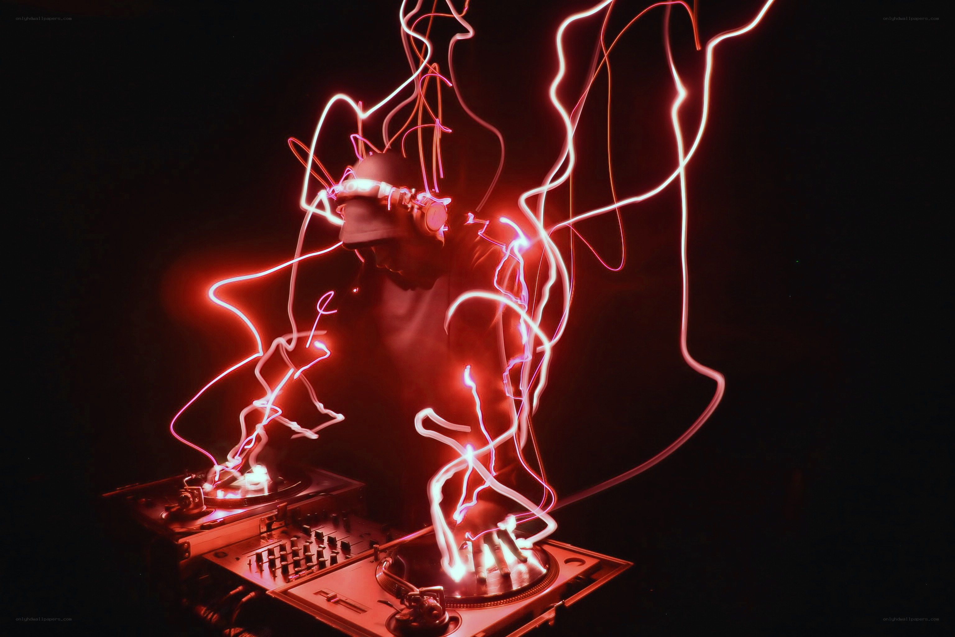 DJ performing with light trails