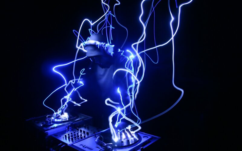Dj Performing with Lights — Blue, Dramatic