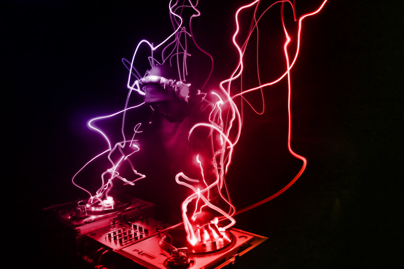 Dj Performing with Lights — Red, Dramatic