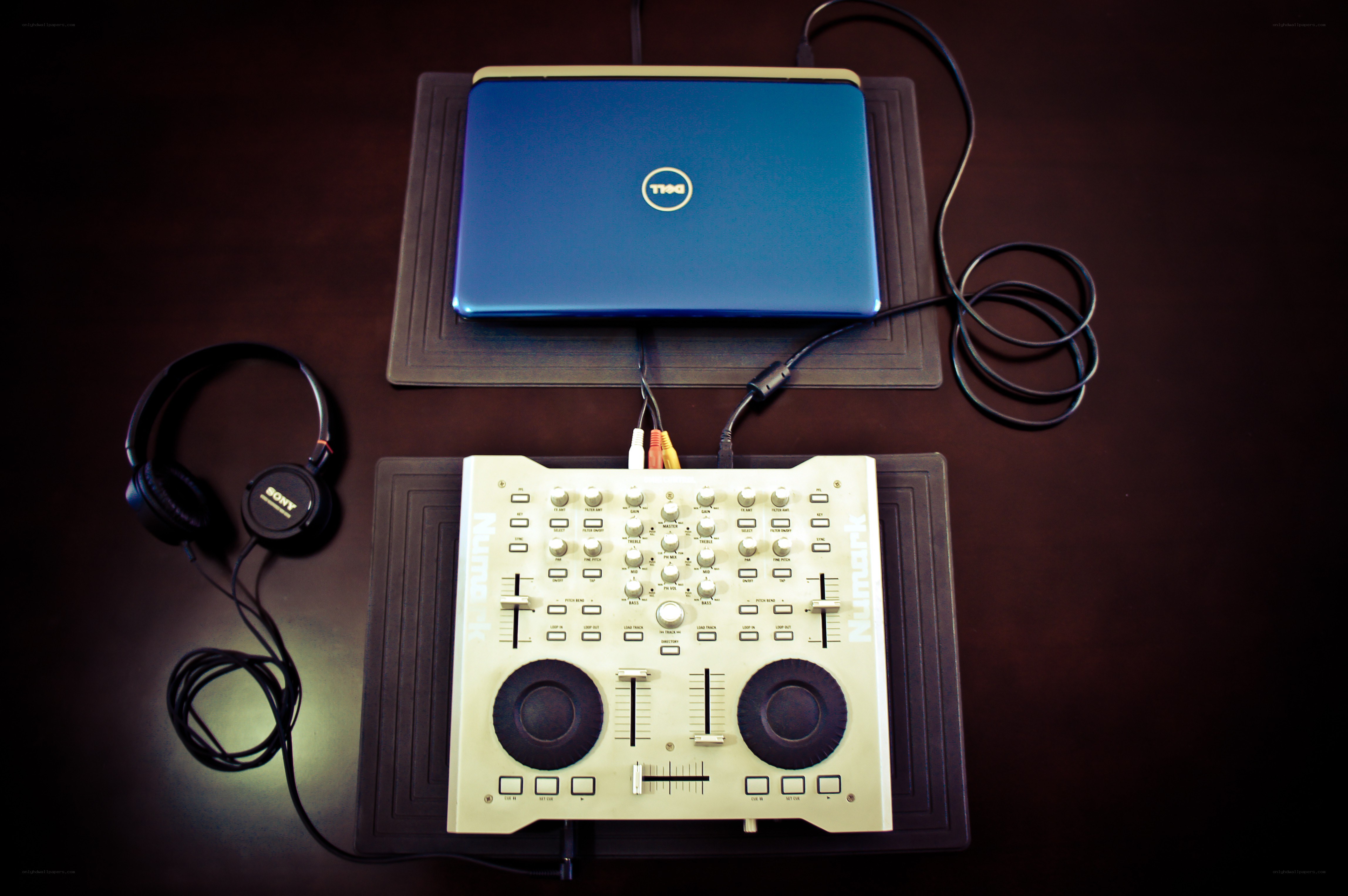 DJ setup with laptop and mixer