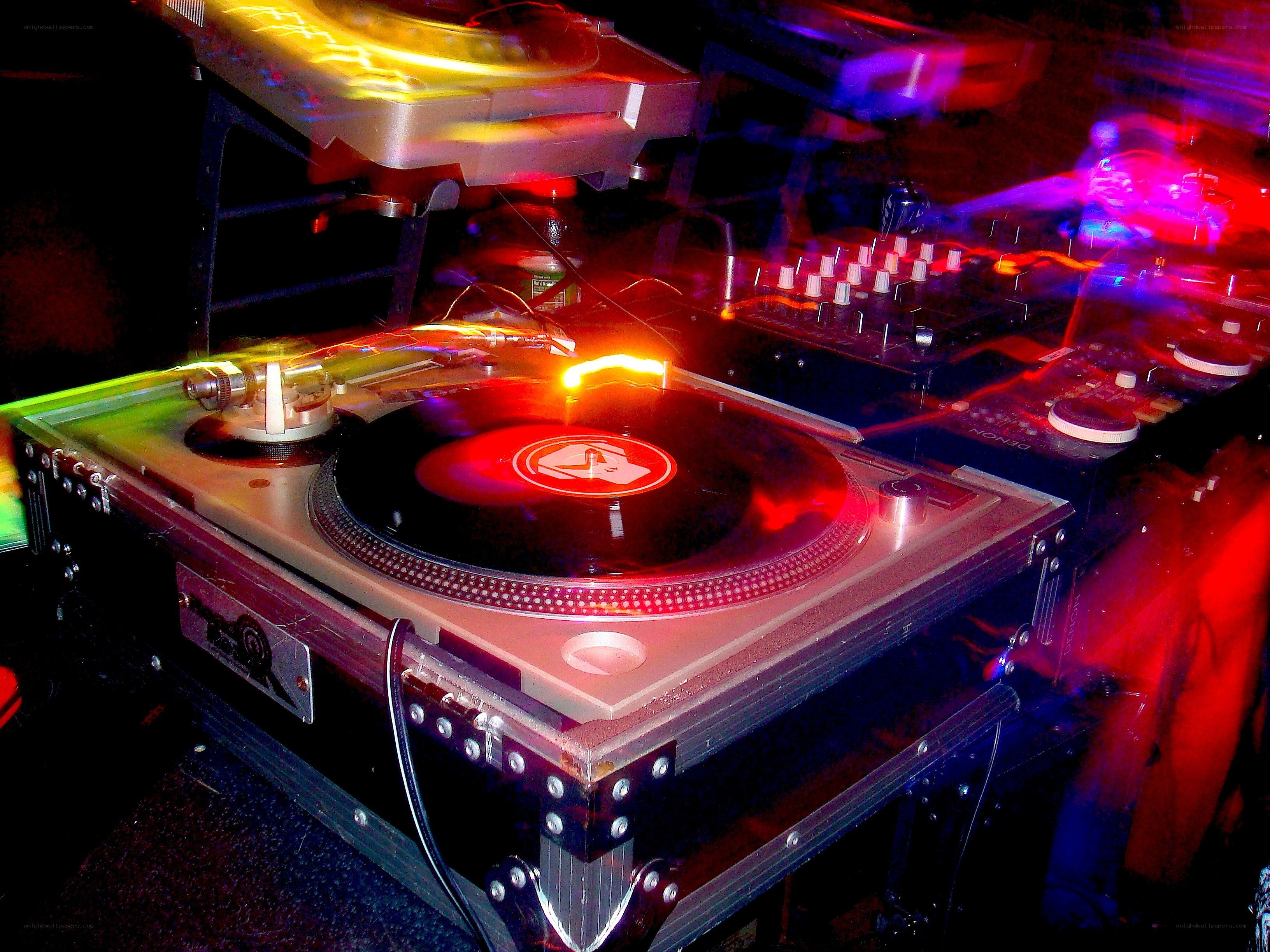 DJ setup with turntables and lights