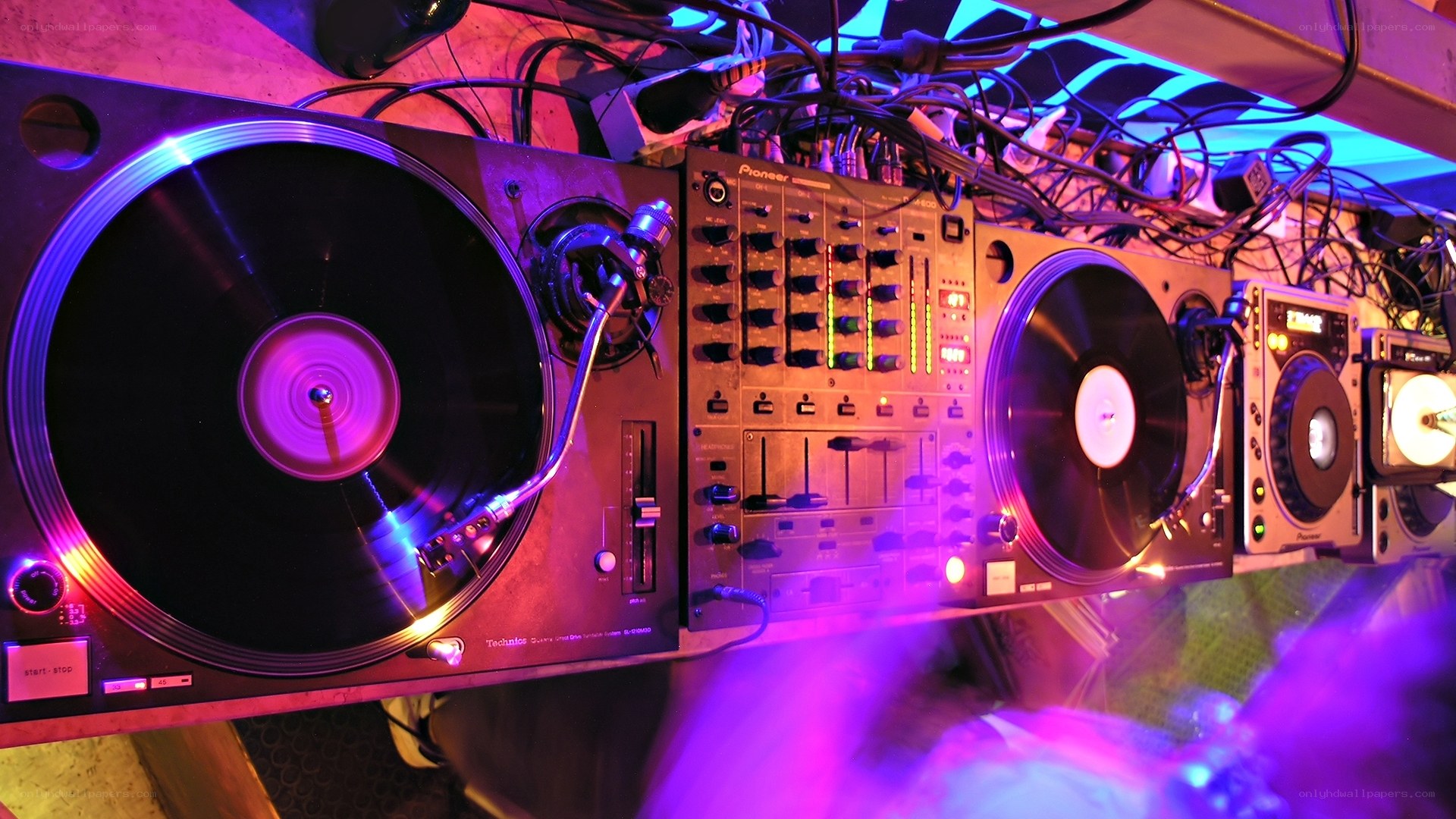 DJ setup with turntables and mixer