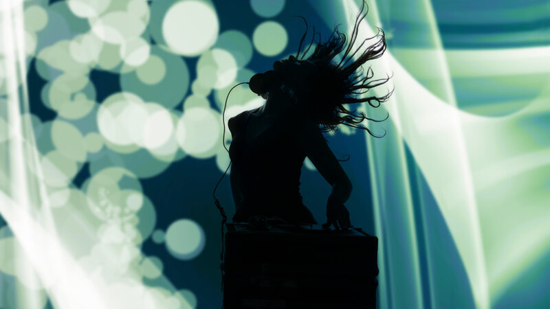 DJ silhouetted against lights
