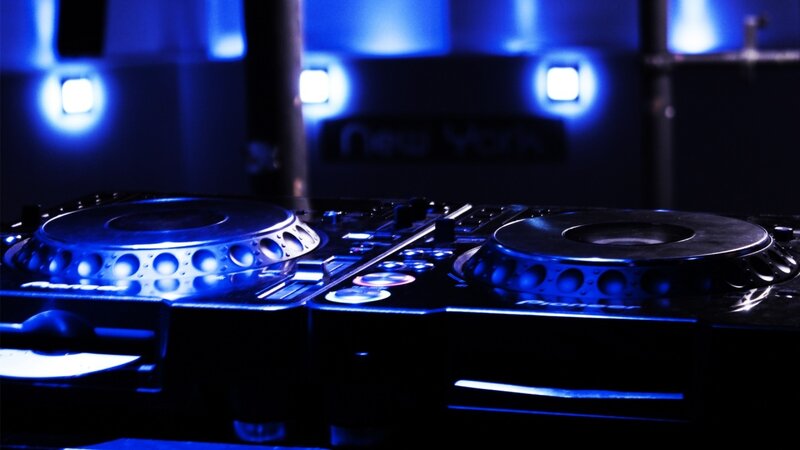 DJ turntables in blue light