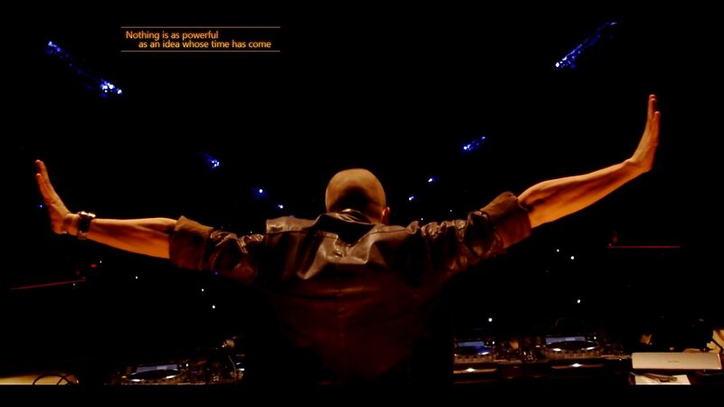 DJ with arms outstretched