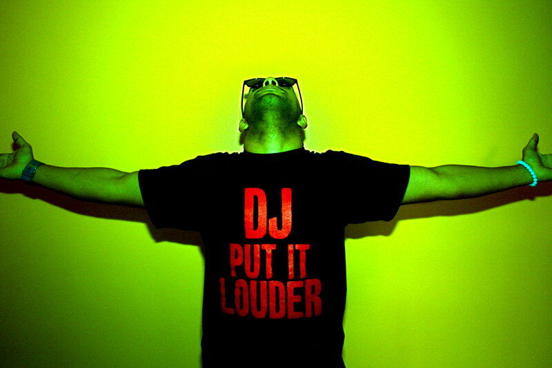 DJ with arms outstretched