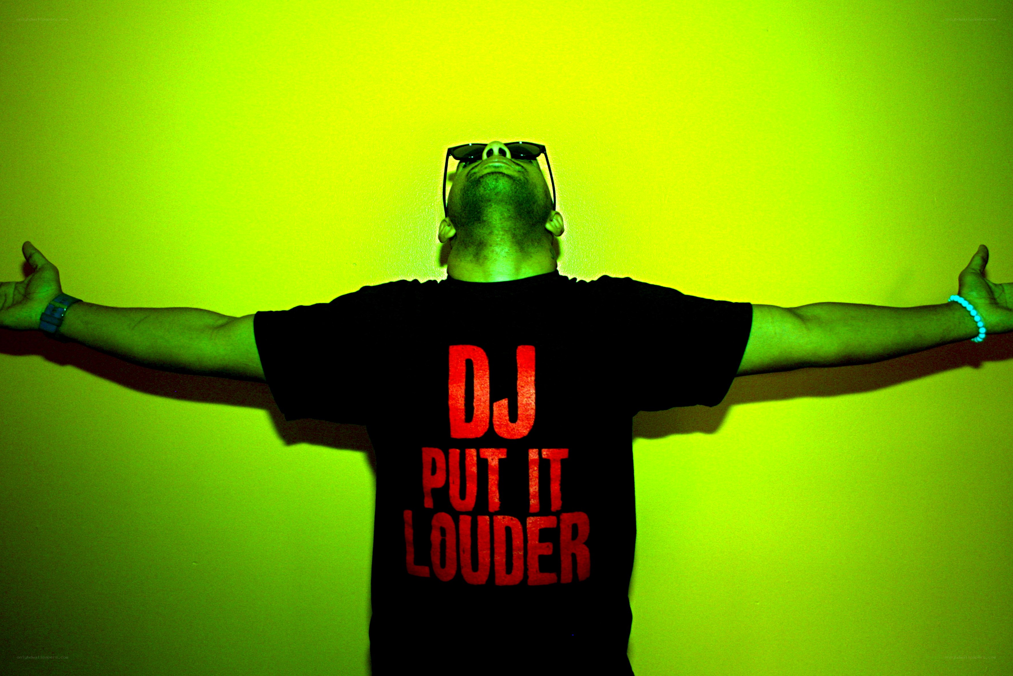 DJ with arms outstretched