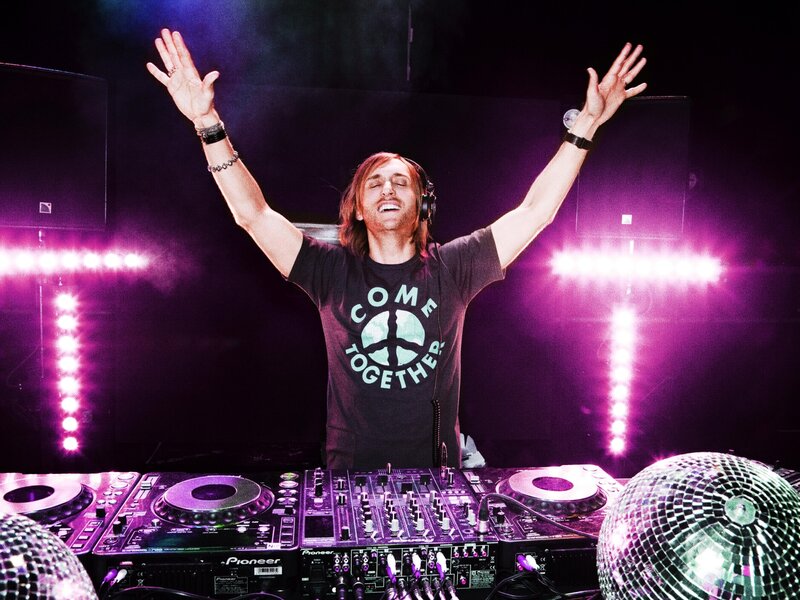 DJ with Arms Raised