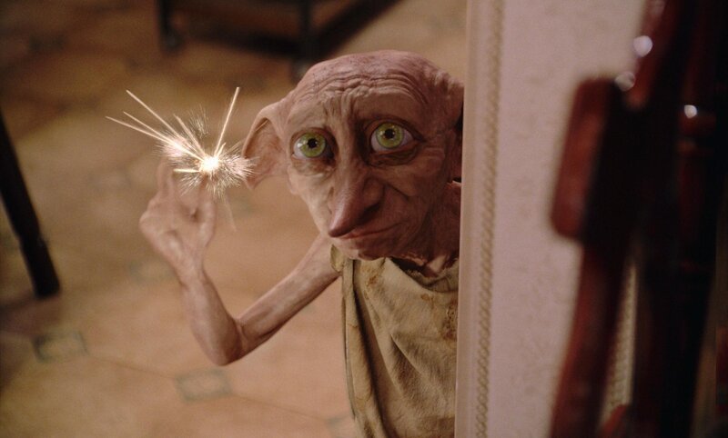 Dobby holding a sparkler