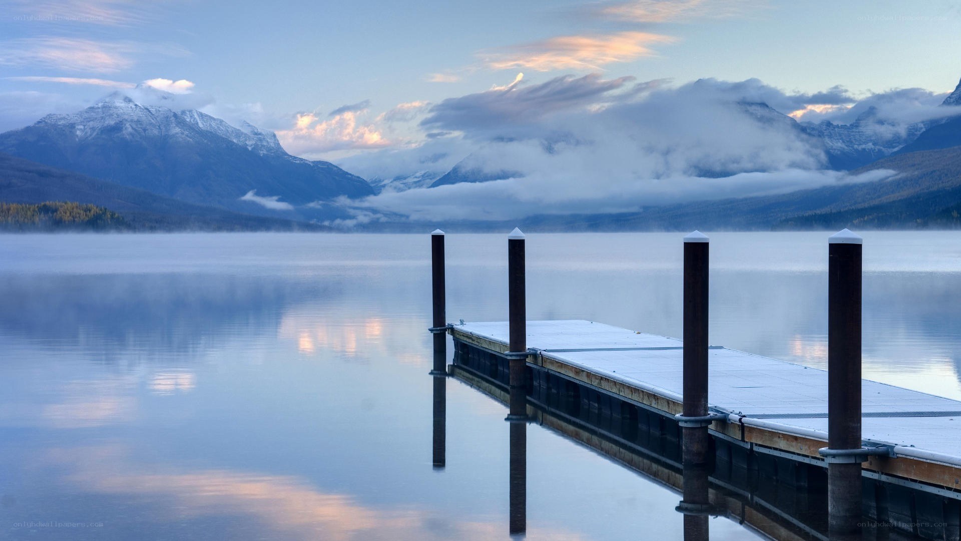 Dock at a misty mountain lake