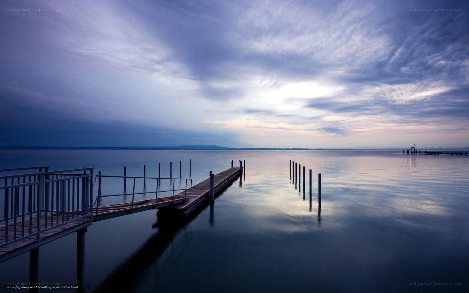 Dock at dusk on a calm lake