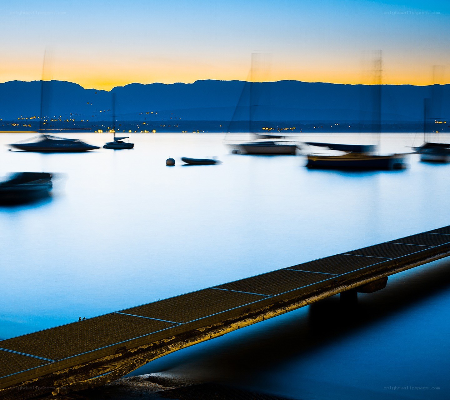 Dock at dusk with boats
