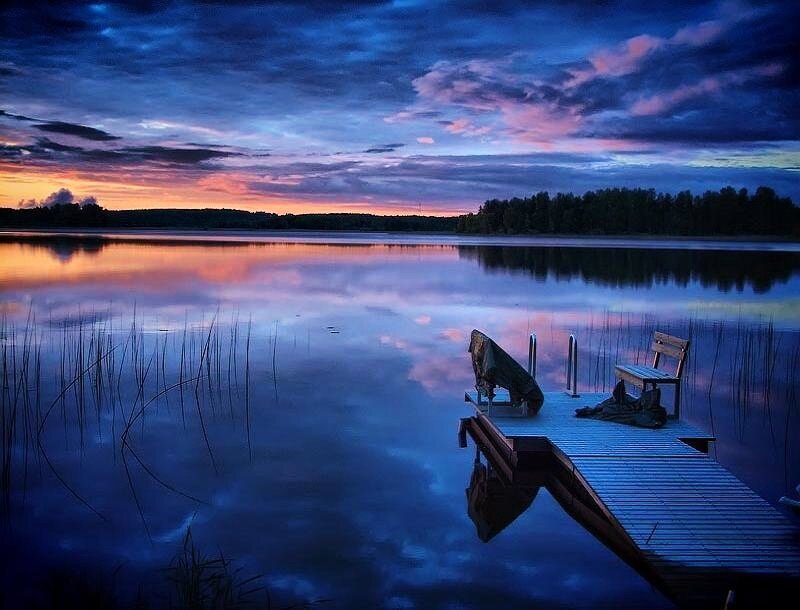 Dock at sunset on a calm lake