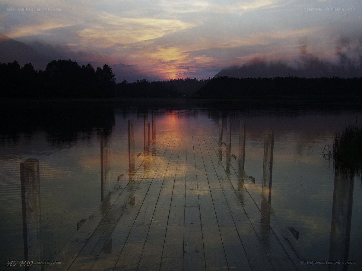Dock at sunset over a lake