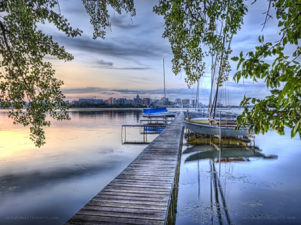 Dock at sunset with city skyline
